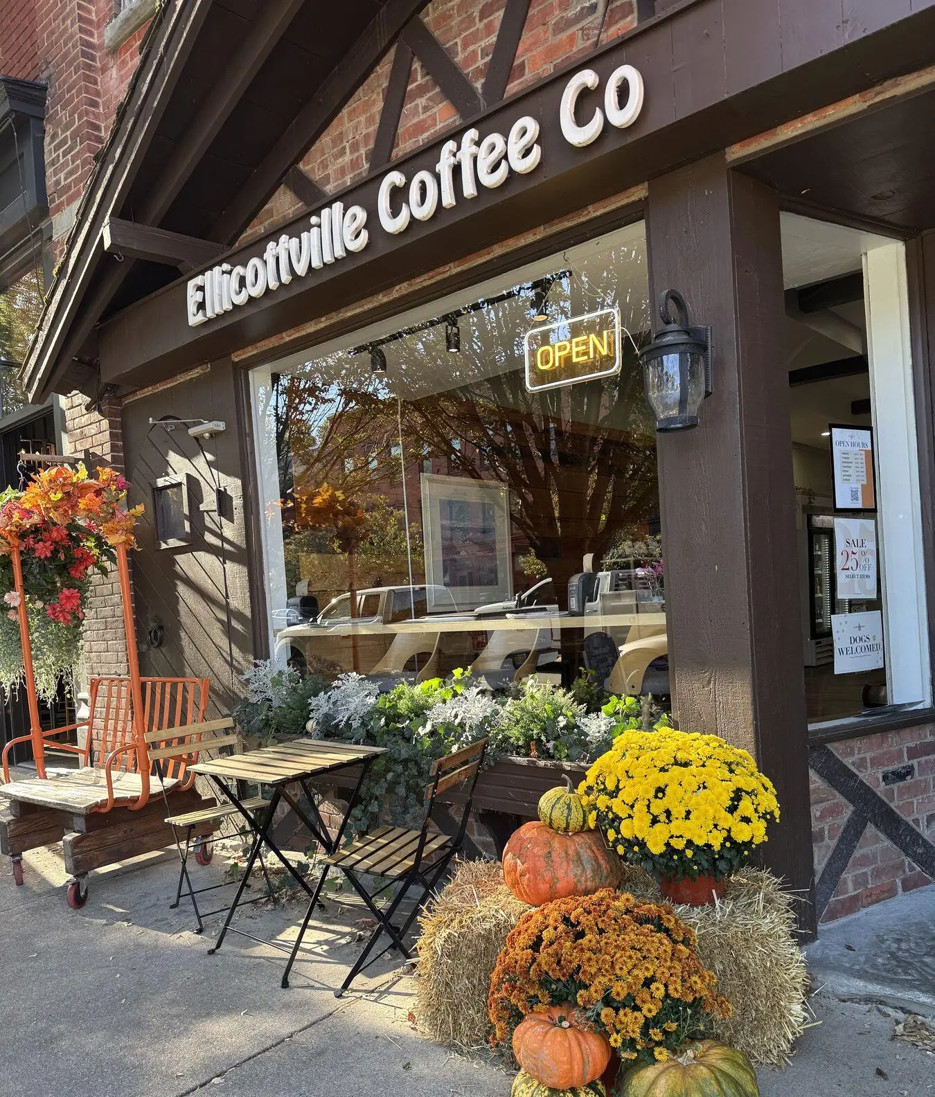 The Ellicottville Coffee Co storefront on Washington Street, with mums, pumpkins and hay bales out front